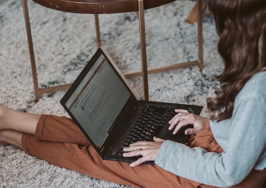 photo of woman sitting on ground